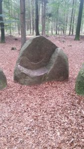 Stone at the other end that looks like a loveseat.