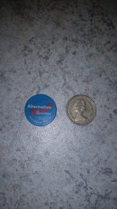 Doober next to a pound coin 